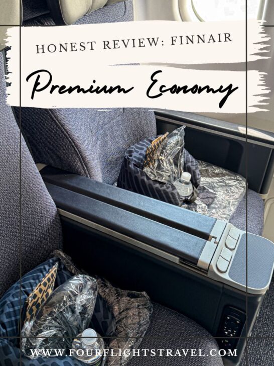 Finnair premium economy seats with amenities, water bottles, and window view on an airplane.