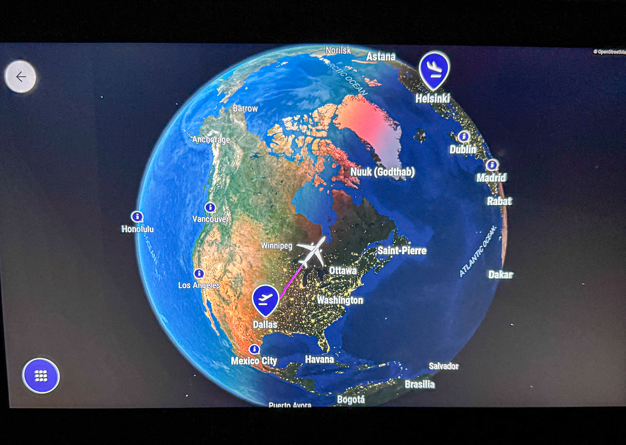 Digital map on Finnair screen display showing a flight route from Dallas to Helsinki over North America and the Atlantic Ocean.